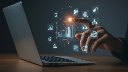 A laptop sits open on a wooden surface, a hand interacts with a glowing, digital interface projecting charts and icons - Powered by Adobe