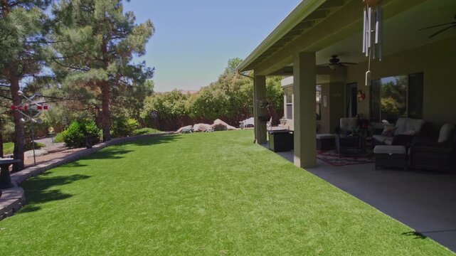 sundrenched backyard featuring trees and patio, open garden area with mature trees and shaded seating