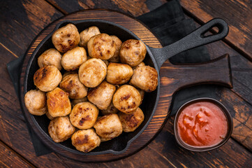 Delicious meatballs, meat patties, showcasing a golden crust and tender interior. isolated on wooden background. top view