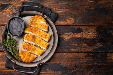 Katsu Golden fried cutlet. This Japanese favorite brings comfort and flavor to any table. wooden background. top view