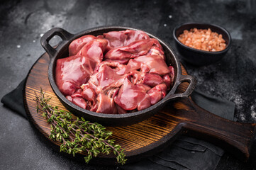 Vibrant raw chicken liver, perfect giblets  for those seeking a protein-rich addition to their meals.black background. top view