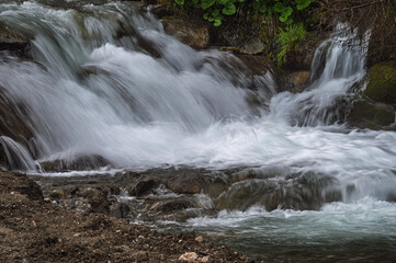 close-up of small waterfall along the creek San Nicolò inside San Nicolò valley, Val di Fassa, Dolomites, Italy