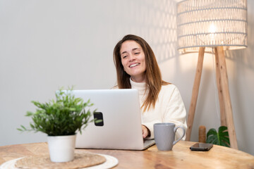 Woman working from home connecting teleconference video call