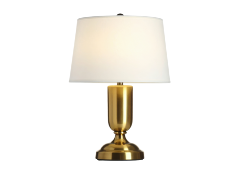 A classic table lamp featuring a polished brass base and a glowing white fabric shade is isolated on a transparent background.