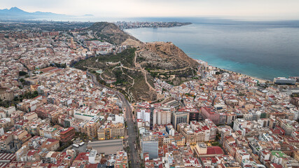 Alicante after sunset. Coastal areas with modern buildings, sea, mountains. Spain. Tourists' choice.