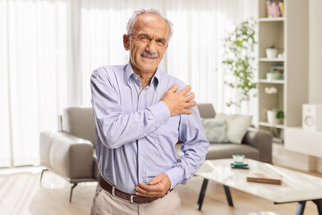 Fototapeta premium Elderly man with ache in shoulder