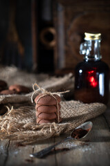 Cookies tied with twine on a rustic table