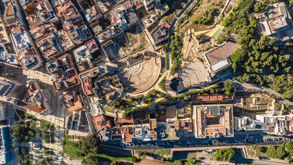 Aerial view of castle, Roman amphitheater. Roman Theater of Cartagena, Spain. Attractions concept.