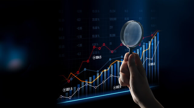 A detailed view of financial graphs with a magnifying glass emphasizes growth trends and statistics, illustrating research insights and investment potential. Scalp