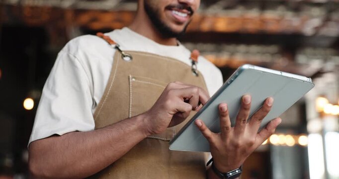 Scroll, server or hands with tablet in restaurant for inventory check, ordering app or schedule delivery. Bokeh, happy man reading or tech for stock management in bistro, online shopping or low angle