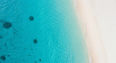 Aerial view of a tropical beach with turquoise water and white sand.