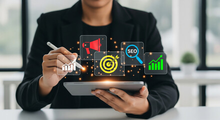 Business professional using a tablet with stylus, engaging with virtual icons for digital marketing strategy, seo, advertising, data analysis, and online growth concepts.