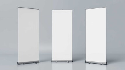 Three blank roll up banner stands isolated on white perfect for advertising and trade show displays