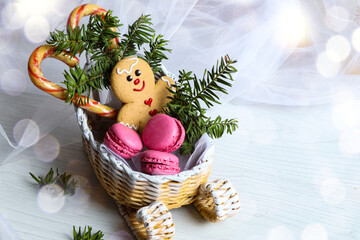A New Year's sleigh with Christmas sweets on a white background with bokeh and space for text