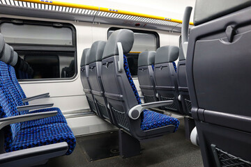 The interior of the train car with soft, comfortable seats