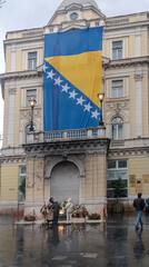 Bosnian flag and wreaths around  Eternal flame for  Statehood Day