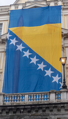 Bosnian flag around  Eternal flame for  Statehood Day
