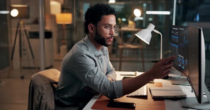 Man, computer screen and writing with trading, graphs and stock market stats with notes at night. Person, trader and pc monitor with charts, fintech or review with book for investment at dark office