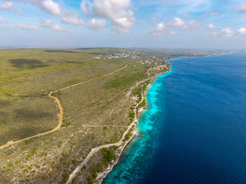 Aerial view of turquoise coastline at 1000 Steps Bonaire - Powered by Adobe