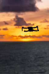 Lombok Indonesia – Drone flying over Bukit Merese capturing cliffs, ocean views and a vibrant sunset on the rugged coastline.