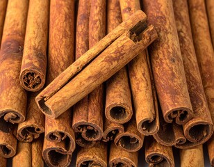 Cinnamon sticks tightly packed, textured brown surface