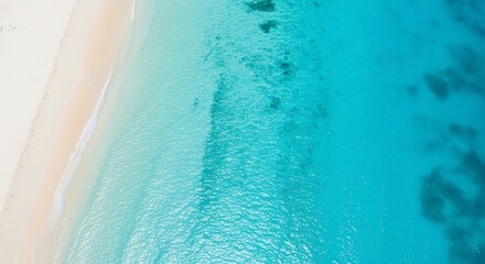 Aerial view of a tropical beach with turquoise water and white sand, showcasing the natural beauty of a coastal paradise.