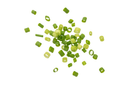 A scattering of freshly chopped green onion pieces, bright green and white, isolated on transparent background