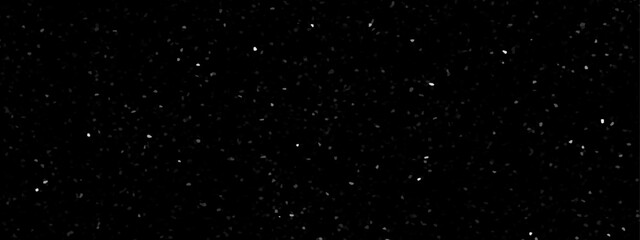 Terrazzo black background with scattered gray and white dots. Rock spatter stone marble backdrop. Black wall texture with noise overlay pattern. Vintage quartz terrazzo flooring.	