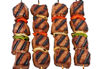 Four perfectly grilled beef shish kebabs with colorful bell pepper and onion pieces threaded onto wooden skewers, isolated on transparent background