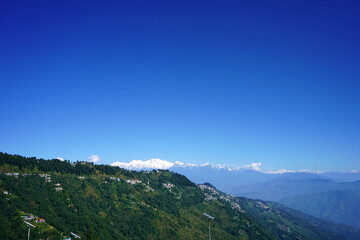 Majestic Kanchenjunga Peak View Over Green Himalayan Foothills Town