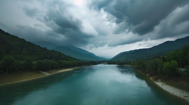 Dramatic mountain river landscape with bridge under stormy sky perfect for travel, adventure, and environmental awareness