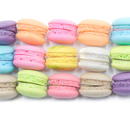 Colorful mini macaroons isolated on white background