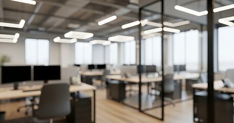 Bright linear lights illuminate a modern open office filled with workstations, glass partitions, and soft natural light from tall windows, creating a clean and spacious professional atmosphere.