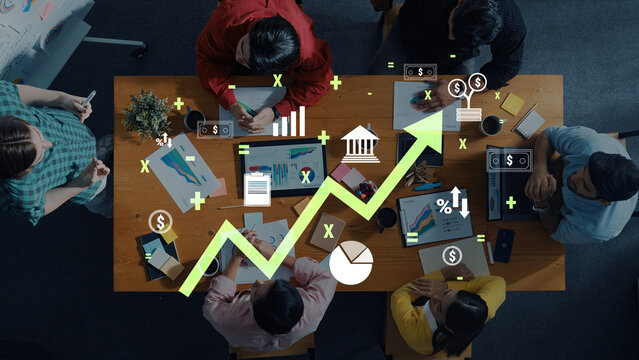 A dynamic scene featuring diverse professionals engaged in a business strategy meeting. The image includes a growth graph and financial icons, symbolizing success and collaboration. Trope