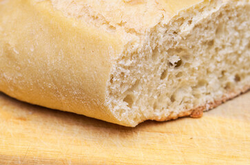 This image showcases a close-up view of a loaf of bread, highlighting its texture and freshness