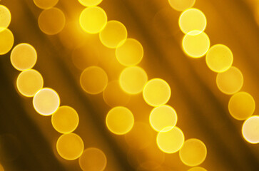 Abstract golden bokeh lights background with diagonal lines and soft focus