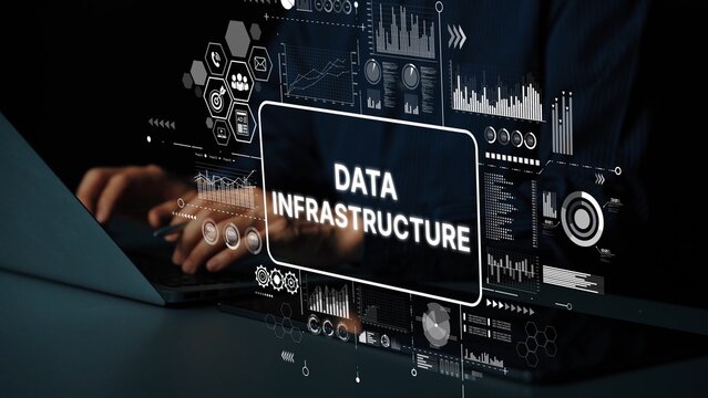 Hands Typing on Laptop with Overlaid Data Infrastructure Graphics and Analytics Visualizations in Dark Office Environment. Asymptotic smart data analytic.