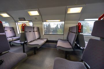 Train interior with empty seats and windows