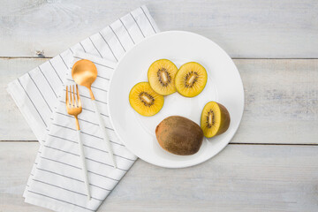 Fresh Chile Gold Kiwi fruit isolated on Wooden background