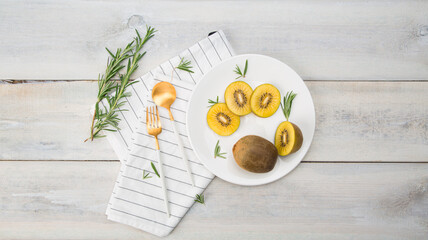 Fresh Chile Gold Kiwi fruit isolated on Wooden background