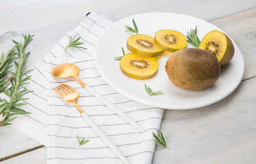 Fresh Chile Gold Kiwi fruit isolated on Wooden background