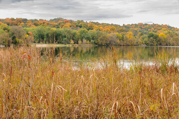 Overlooking Pike Lake, back to the park's beach area with its hillside changing colors in mid-October within Pike Lake Unit, Kettle Moraine State Forest, Hartford, Wisconsin