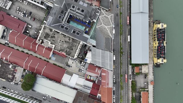 day time penang island george town old city center traffic bay street aerial topdown panorama 4k malaysia
