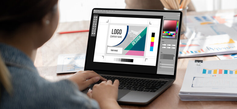 Graphic designer software for modern design of web page and commercial brisk ads showing on the computer screen