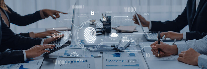 A group of professionals engaged in a business meeting discussing cybersecurity innovations. The digital fingerprint symbolizes advanced security technology in a modern workspace. Trope