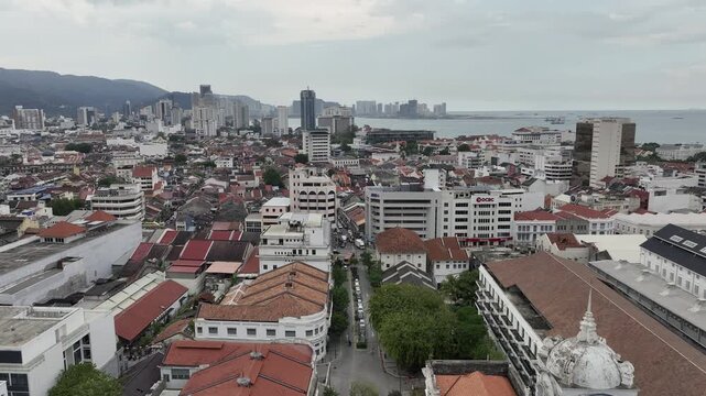 day time penang island george town cityscape abandoned hotel broken tower bay aerial panorama 4k malaysia