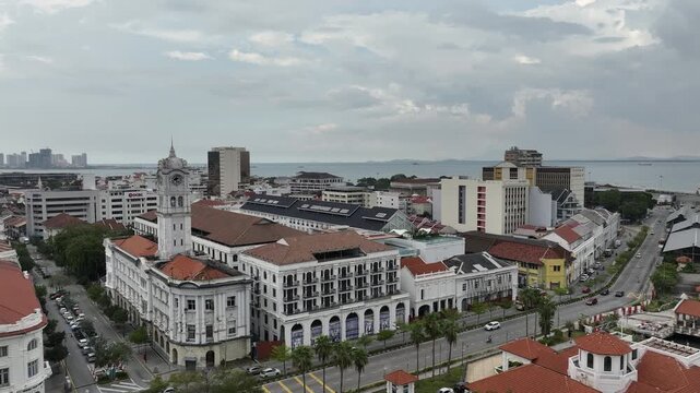 day time penang island george town cityscape bay traffic street abandoned hotel tower aerial panorama 4k malaysia