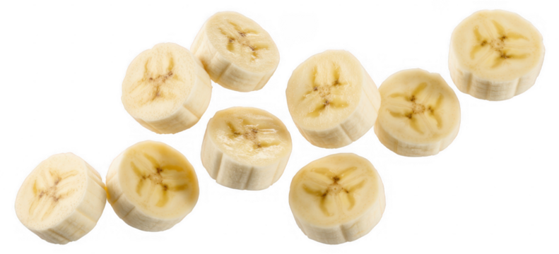 Sliced banana pieces scattered on black isolated on a transparent background
