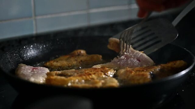 Man Frying Corvina Fish in Pan &ndash; Cooking Seafood Video