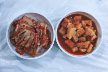 Kimchi and Kkakdugi Side Dishes in Ceramic Bowls